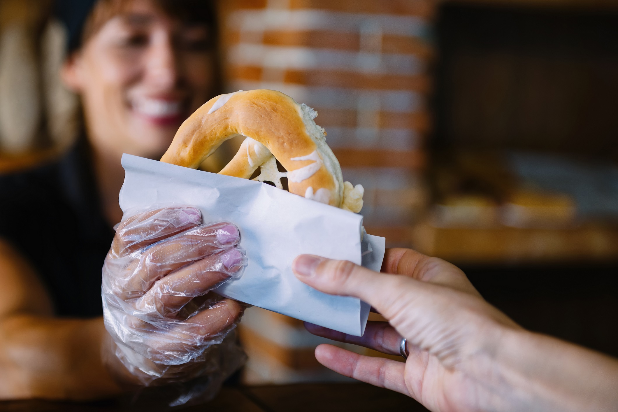 female-bakery-worker-serving-customer-wiselist-save-money-on